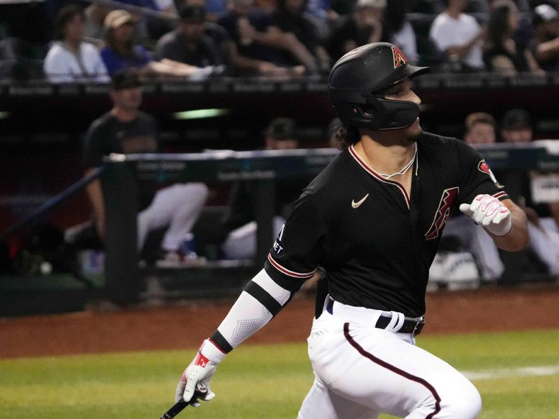 Aug 8, 2023; Phoenix, Arizona, USA; Arizona Diamondbacks pinch hitter Alek Thomas (5) hits an RBI single against the Los Angeles Dodgers during the ninth inning at Chase Field. Mandatory Credit: Joe Camporeale-USA TODAY Sports