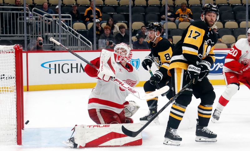 Oct 1, 2024; Pittsburgh, Pennsylvania, USA;  Pittsburgh Penguins left wing Michael Bunting (8) hits the post behind Detroit Red Wings goaltender Ville Husso (35) during the third period at PPG Paints Arena. Detroit won 2-1. Mandatory Credit: Charles LeClaire-Imagn Images