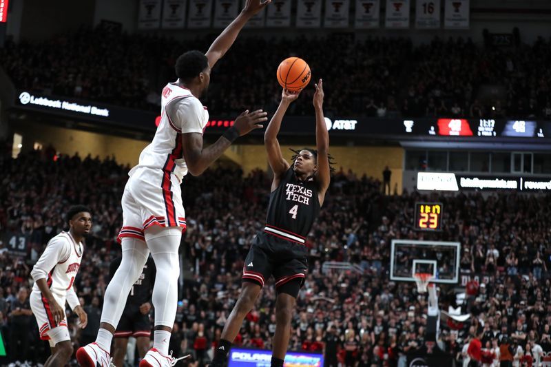 Feb 24, 2025; Lubbock, Texas, USA;  Texas Tech Red Raiders guard Christian Anderson (4) shoots over Houston Cougars forward Ja’Vier Francis (5) in the second half at United Supermarkets Arena. Mandatory Credit: Michael C. Johnson-Imagn Images