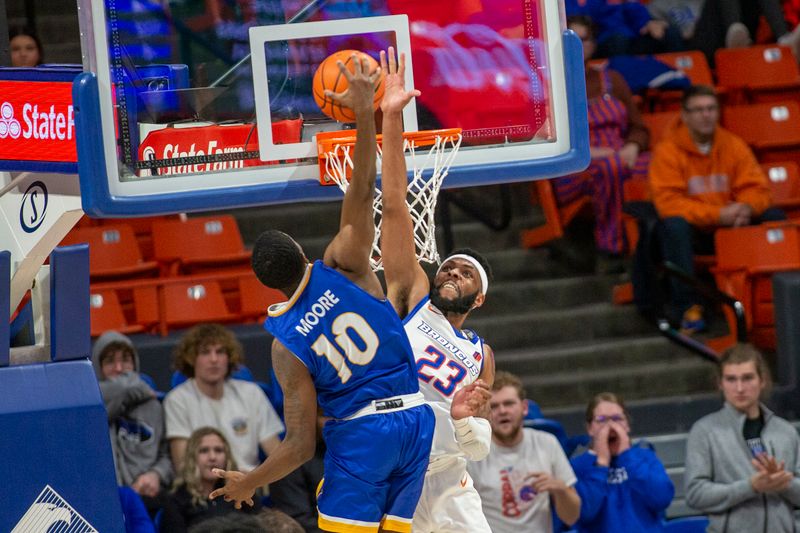 Jan 3, 2023; Boise, Idaho, USA; San Jose State Spartans guard Omari Moore (10) dunks on Boise State Broncos forward Naje Smith (23) during the second half at ExtraMile Arena. Mandatory Credit: Brian Losness-USA TODAY Sports