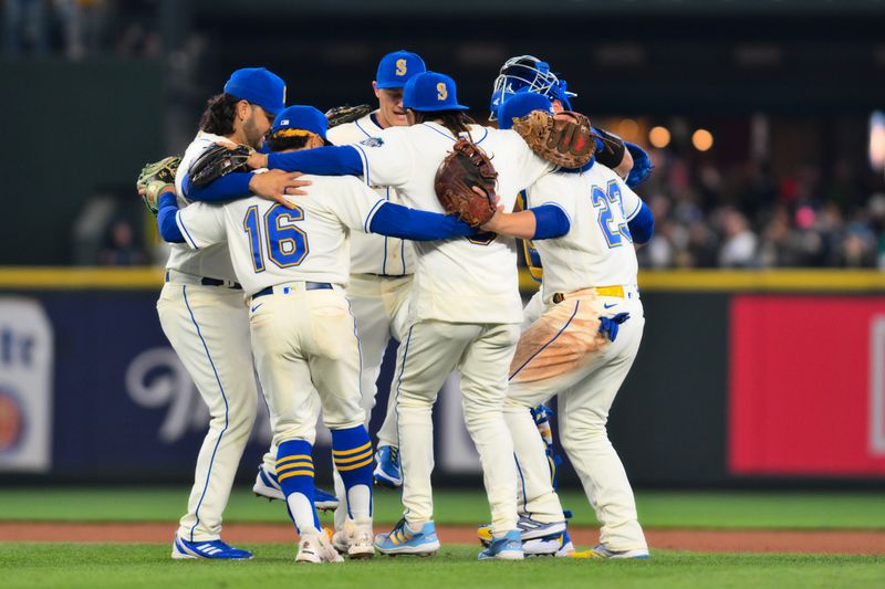 Apr 16, 2023; Seattle, Washington, USA; The Seattle Mariners infielders celebrate defeating the Colorado Rockies at T-Mobile Park. Mandatory Credit: Steven Bisig-USA TODAY Sports