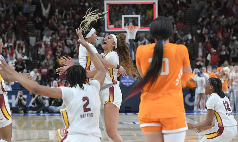 Mar 9, 2024; Greenville, SC, USA; South Carolina Gamecocks center Kamilla Cardoso (10) celebrates with guard Te-Hina Paopao (0) after the game winning basket against the Tennessee Lady Vols during the fourth quarter at the Bon Secours Wellness Arena. Mandatory Credit: Ken Ruinard/The Greenville News via USA TODAY NETWORK