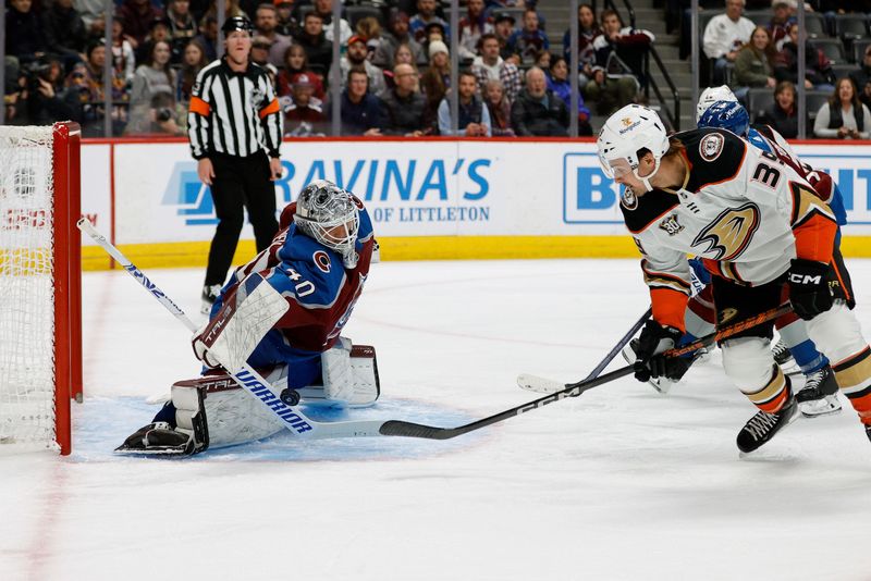 Dec 5, 2023; Denver, Colorado, USA; Colorado Avalanche goaltender Alexandar Georgiev (40) makes a save against Anaheim Ducks center Sam Carrick (39) in the first period at Ball Arena. Mandatory Credit: Isaiah J. Downing-USA TODAY Sports