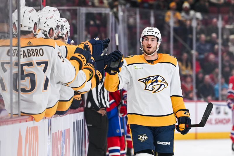 Dec 10, 2023; Montreal, Quebec, CAN; Nashville Predators center Colton Sissons (10) celebrates his goal against the Montreal Canadiens with his teammates at the bench during the first period at Bell Centre. Mandatory Credit: David Kirouac-USA TODAY Sports
