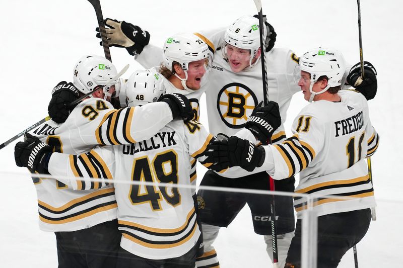 Jan 11, 2024; Las Vegas, Nevada, USA; Boston Bruins defenseman Matt Grzelcyk (48) celebrates with team mates after scoring a goal against the Vegas Golden Knights during the third period at T-Mobile Arena. Mandatory Credit: Stephen R. Sylvanie-USA TODAY Sports