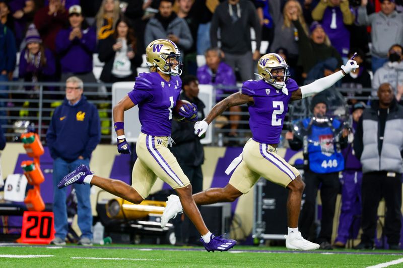 Sep 23, 2023; Seattle, Washington, USA; Washington Huskies wide receiver Rome Odunze (1) returns a punt for a touchdown against the California Golden Bears while under escort from wide receiver JaLynn Polk (2) during the first quarter at Alaska Airlines Field at Husky Stadium. Mandatory Credit: Joe Nicholson-USA TODAY Sports