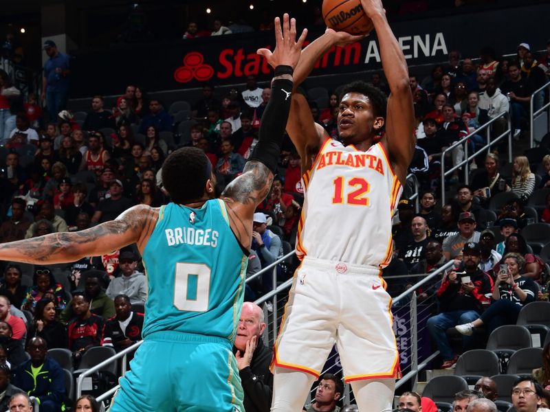 ATLANTA, GA - MARCH 23: De'Andre Hunter #12 of the Atlanta Hawks shoots the ball during the game against the Charlotte Hornets on March 23, 2024 at State Farm Arena in Atlanta, Georgia.  NOTE TO USER: User expressly acknowledges and agrees that, by downloading and/or using this Photograph, user is consenting to the terms and conditions of the Getty Images License Agreement. Mandatory Copyright Notice: Copyright 2024 NBAE (Photo by Scott Cunningham/NBAE via Getty Images)