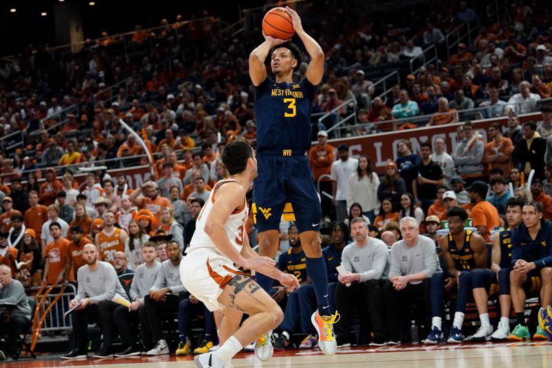 Feb 11, 2023; Austin, Texas, USA; West Virginia Mountaineers forward Tre Mitchell (3) shoots over Texas Longhorns forward Brock Cunningham (30) during the second half at Moody Center. Mandatory Credit: Scott Wachter-USA TODAY Sports