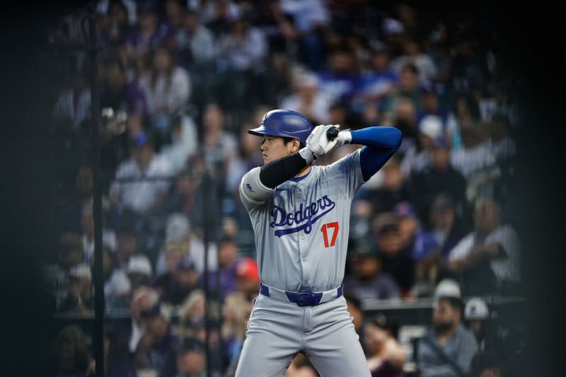 Jun 18, 2024; Denver, Colorado, USA; Los Angeles Dodgers designated hitter Shohei Ohtani (17) on deck in the seventh inning against the Colorado Rockies at Coors Field. Mandatory Credit: Isaiah J. Downing-USA TODAY Sports