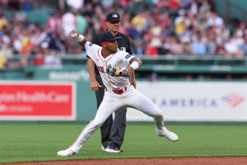 Jun 24, 2024; Boston, Massachusetts, USA; Boston Red Sox shortstop Ceddanne Rafaela (43) throws to first during the third inning against the Toronto Blue Jays at Fenway Park. Mandatory Credit: Paul Rutherford-USA TODAY Sports