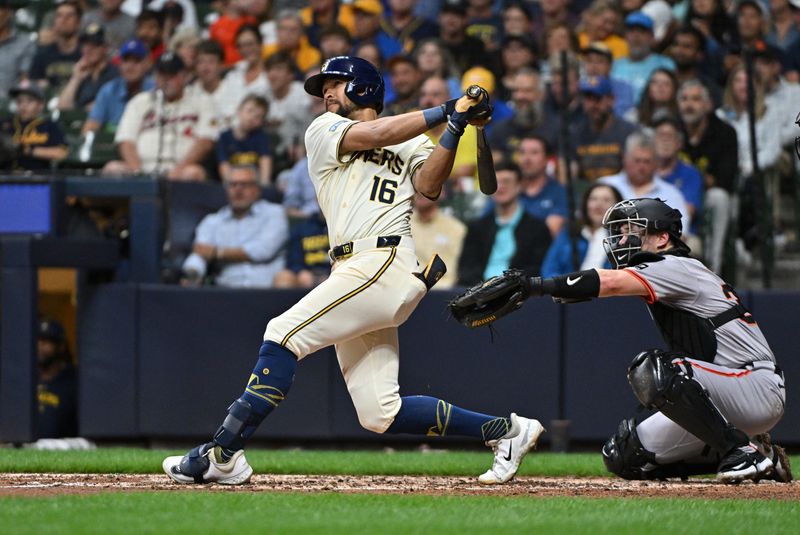 Aug 28, 2024; Milwaukee, Wisconsin, USA; Milwaukee Brewers outfielder Blake Perkins (16) drives in a run against the San Francisco Giants in the fifth inning at American Family Field. Mandatory Credit: Michael McLoone-USA TODAY Sports