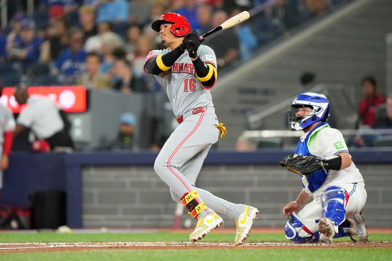 Aug 20, 2024; Toronto, Ontario, CAN; Cincinnati Reds third baseman Noelvi Marte (16) hits an RBI single against the Toronto Blue Jays during the second inning at Rogers Centre. Mandatory Credit: John E. Sokolowski-USA TODAY Sports