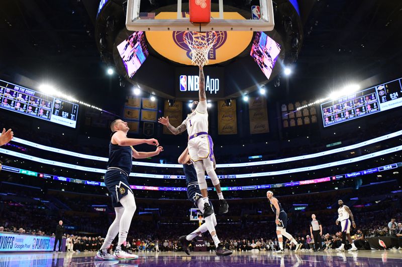 LOS ANGELES, CA - APRIL 27: D'Angelo Russell #1 of the Los Angeles Lakers drives to the basket during the game against the Denver Nuggets during Round 1 Game 4 of the 2024 NBA Playoffs on April 27, 2024 at Crypto.Com Arena in Los Angeles, California. NOTE TO USER: User expressly acknowledges and agrees that, by downloading and/or using this Photograph, user is consenting to the terms and conditions of the Getty Images License Agreement. Mandatory Copyright Notice: Copyright 2024 NBAE (Photo by Adam Pantozzi/NBAE via Getty Images)