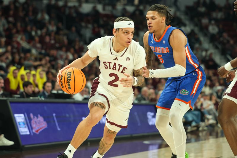 Feb 11, 2025; Starkville, Mississippi, USA; Mississippi State Bulldogs guard Riley Kugel (2) handles the ball against Florida Gators guard Will Richard (5) during the second half at Humphrey Coliseum. Mandatory Credit: Wesley Hale-Imagn Images