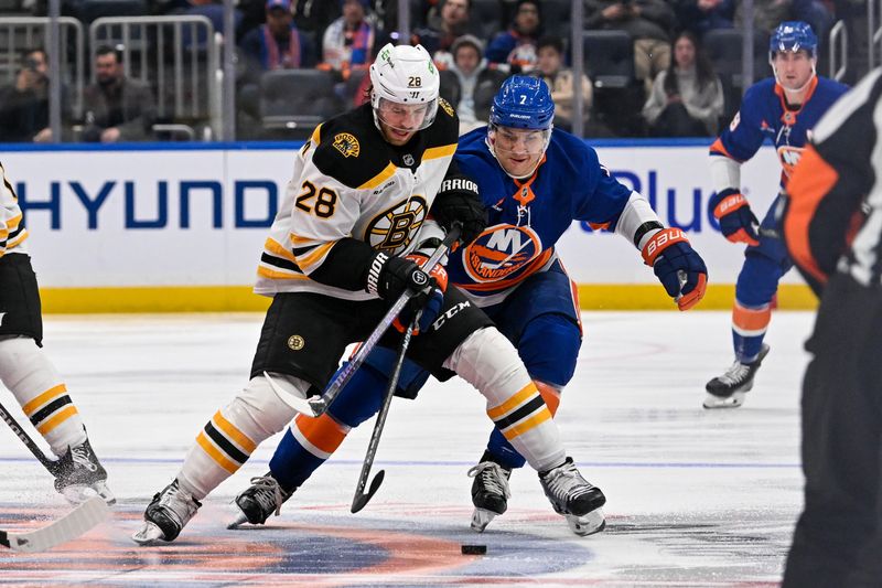 Nov 27, 2024; Elmont, New York, USA;  Boston Bruins defenseman Parker Wotherspoon (29) and New York Islanders right wing Maxim Tsyplakov (7) battle for the puck at center ice during the third period at UBS Arena. Mandatory Credit: Dennis Schneidler-Imagn Images