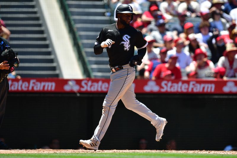 Jun 29, 2023; Anaheim, California, USA; Chicago White Sox center fielder Luis Robert Jr. (88) scores a run against the Los Angeles Angels during the third inning at Angel Stadium. Mandatory Credit: Gary A. Vasquez-USA TODAY Sports