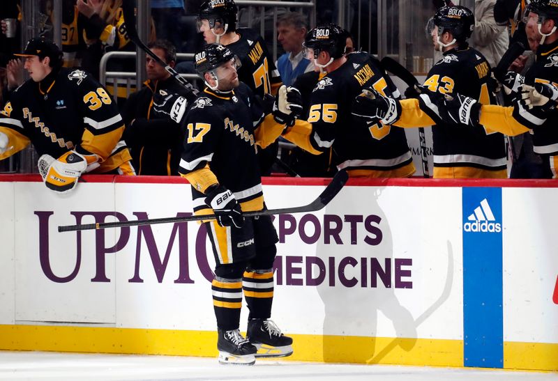 Feb 22, 2024; Pittsburgh, Pennsylvania, USA; Pittsburgh Penguins right wing Bryan Rust (17) celebrates with the Pens bench after scoring a goal against the Montreal Canadiens during the second period at PPG Paints Arena. The Penguins won 4-1. Mandatory Credit: Charles LeClaire-USA TODAY Sports