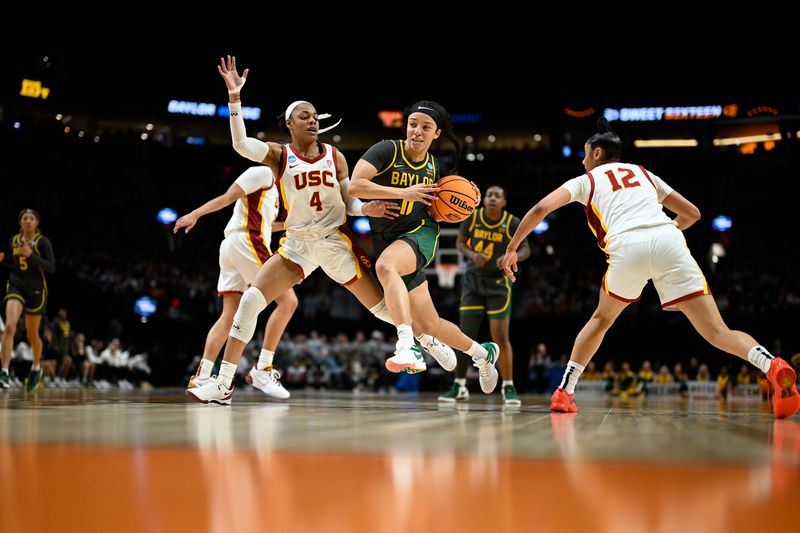 Mar 30, 2024; Portland, OR, USA; Baylor Lady Bears guard Jada Walker (11) drives to the basket during the first half against USC Trojans guard Kayla Williams (4) in the semifinals of the Portland Regional of the 2024 NCAA Tournament at the Moda Center. Mandatory Credit: Troy Wayrynen-USA TODAY Sports