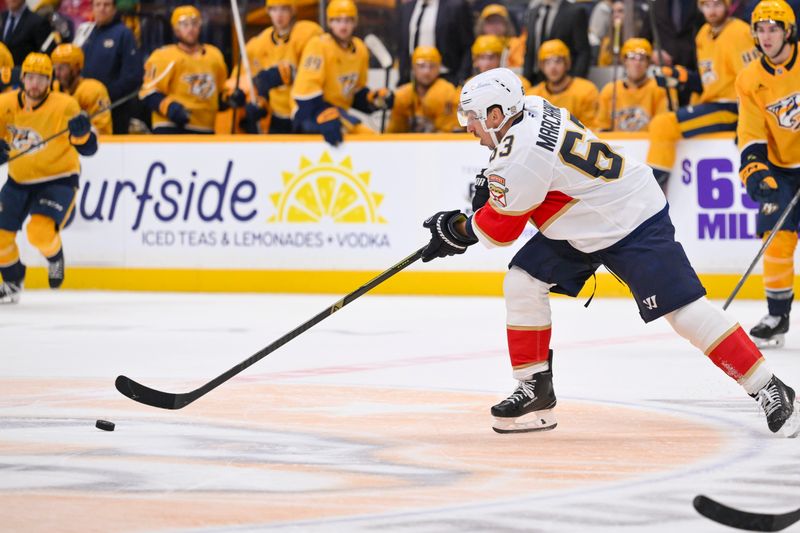 Nov 24, 2025; Nashville, Tennessee, USA;  Florida Panthers forward Brad Marchand (6) shoots the puck against the Nashville Predators during the second period at Bridgestone Arena. Mandatory Credit: Steve Roberts-Imagn Images