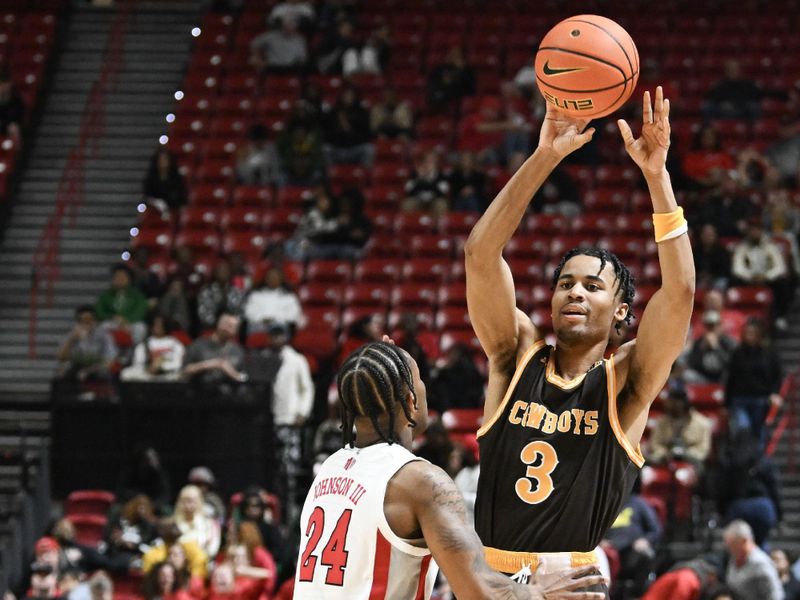 Feb 3, 2024; Las Vegas, Nevada, USA; Wyoming Cowboys guard Sam Griffin (3) makes a pass past UNLV Rebels guard Jackie Johnson III (24) in the second half at Thomas & Mack Center. Mandatory Credit: Candice Ward-USA TODAY Sports