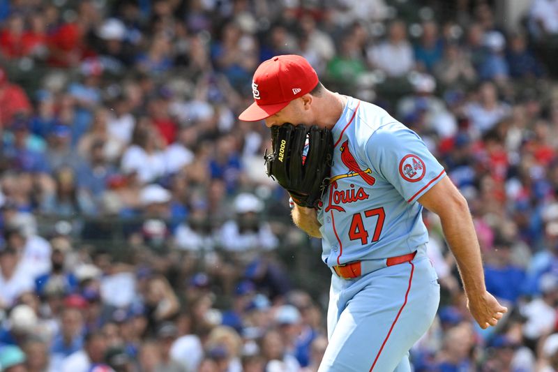 Jun 15, 2024; Chicago, Illinois, USA;  St. Louis Cardinals pitcher John King (47) yells into his mitt after Chicago Cubs outfielder Ian Happ (8) hits a three run home run  during the seventh inning at Wrigley Field. Mandatory Credit: Matt Marton-USA TODAY Sports