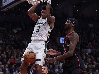 TORONTO, ON- NOVEMBER 15  - Milwaukee Bucks forward MarJon Beauchamp (3) dunks in front of Toronto Raptors forward Jalen McDaniels (2) as the Toronto Raptors play the Milwaukee Bucks at Scotiabank Arena in Toronto. November 15, 2023.        (Steve Russell/Toronto Star via Getty Images)