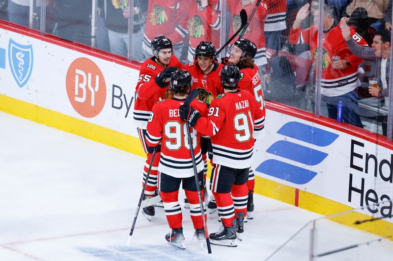 Nov 20, 2025; Chicago, Illinois, USA; Chicago Blackhawks center Teuvo Teravainen (86) celebrates with teammates after scoring against the Seattle Kraken during the second period at United Center. Mandatory Credit: Kamil Krzaczynski-Imagn Images