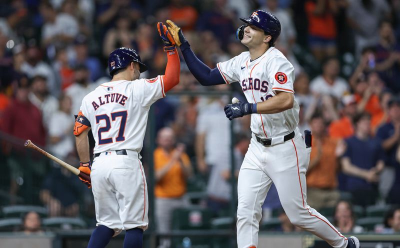 May 16, 2024; Houston, Texas, USA; Houston Astros left fielder Joey Loperfido (10) celebrates with second baseman Jose Altuve (27) after hitting a home run during the third inning against the Oakland Athletics at Minute Maid Park. Mandatory Credit: Troy Taormina-USA TODAY Sports