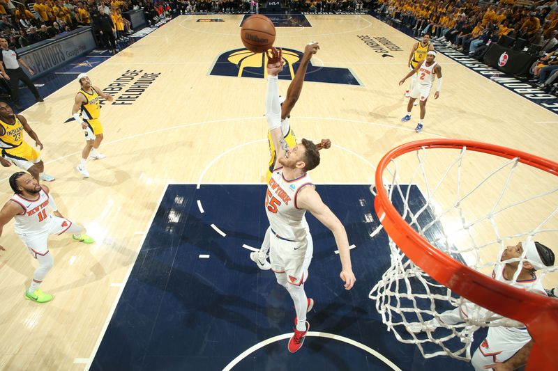 INDIANAPOLIS, IN - MAY 17: Isaiah Hartenstein #55 of the New York Knicks rebounds the ball during the game against the Indiana Pacers during Round 2 Game 6 of the 2024 NBA Playoffs on May 17, 2024 at Gainbridge Fieldhouse in Indianapolis, Indiana. NOTE TO USER: User expressly acknowledges and agrees that, by downloading and or using this Photograph, user is consenting to the terms and conditions of the Getty Images License Agreement. Mandatory Copyright Notice: Copyright 2024 NBAE (Photo by Nathaniel S. Butler/NBAE via Getty Images)