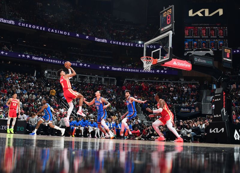 ATLANTA, GA - JANUARY 3: Jalen Johnson #1 of the Atlanta Hawks shoots the ball during the game against the Oklahoma City Thunder on January 3, 2024 at State Farm Arena in Atlanta, Georgia.  NOTE TO USER: User expressly acknowledges and agrees that, by downloading and/or using this Photograph, user is consenting to the terms and conditions of the Getty Images License Agreement. Mandatory Copyright Notice: Copyright 2024 NBAE (Photo by Scott Cunningham/NBAE via Getty Images)