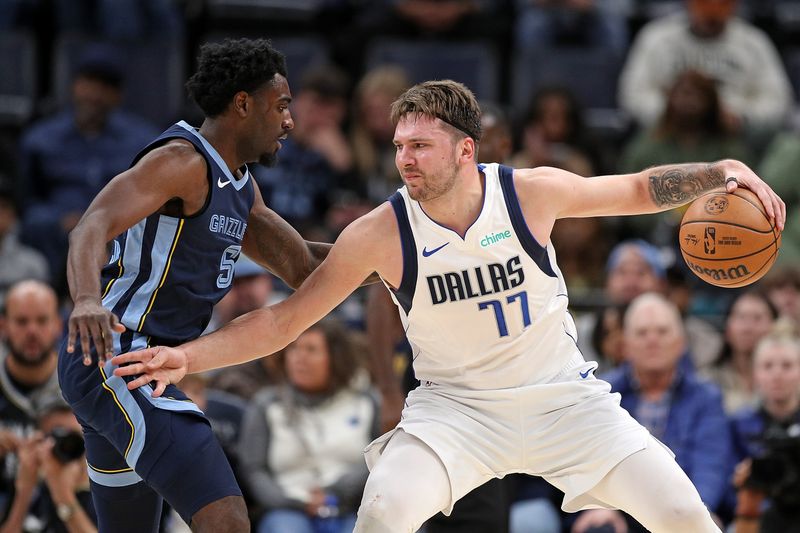 MEMPHIS, TENNESSEE - DECEMBER 11: Luka Doncic #77 of the Dallas Mavericks handles the ball against Vince Williams Jr. #5 of the Memphis Grizzlies during the second half at FedExForum on December 11, 2023 in Memphis, Tennessee. NOTE TO USER: User expressly acknowledges and agrees that, by downloading and or using this photograph, User is consenting to the terms and conditions of the Getty Images License Agreement.  (Photo by Justin Ford/Getty Images)