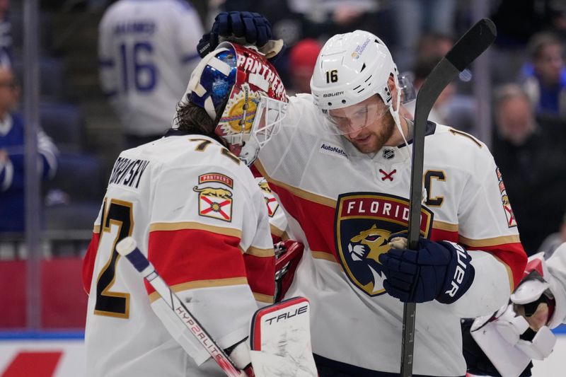May 18, 2025; Toronto, Ontario, CAN; Florida Panthers forward Aleksander Barkov (16) and goaltender Sergei Bobrovsky (72) celebrate winning game seven of the second round of the 2025 Stanley Cup Playoffs over the Toronto Maple Leafs at Scotiabank Arena. Mandatory Credit: John E. Sokolowski-Imagn Images