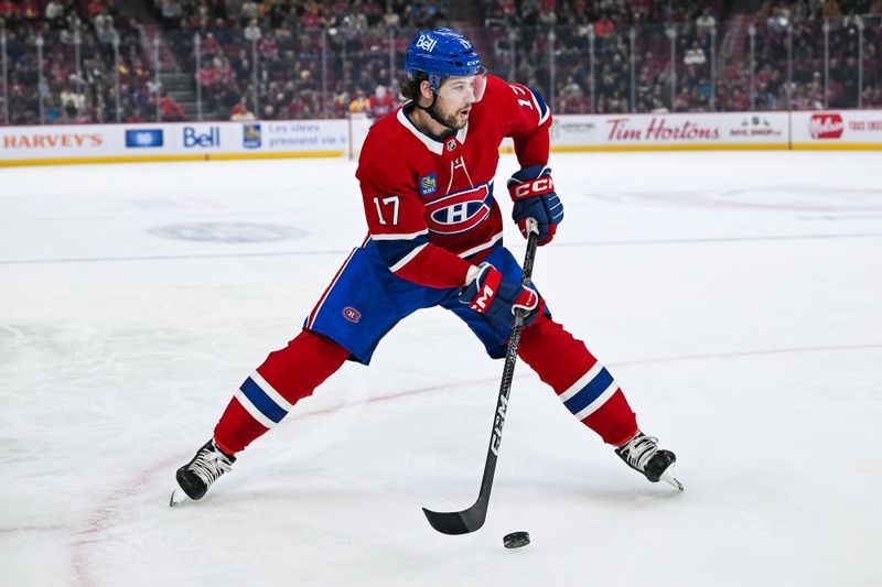 Dec 10, 2023; Montreal, Quebec, CAN; Montreal Canadiens right wing Josh Anderson (17) plays the puck against the Nashville Predators during the first period at Bell Centre. Mandatory Credit: David Kirouac-USA TODAY Sports