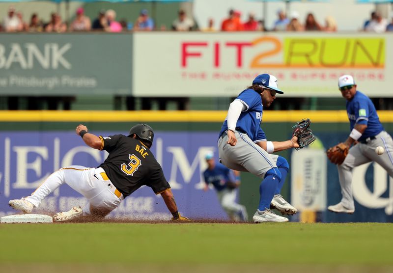 Mar 5, 2024; Bradenton, Florida, USA;  Pittsburgh Pirates infielder/outfielder Ji Hwan Bae (3) steals second base as Toronto Blue Jays shortstop Bo Bichette (11) attempts to tag him out during the third inning  at LECOM Park. Mandatory Credit: Kim Klement Neitzel-USA TODAY Sports