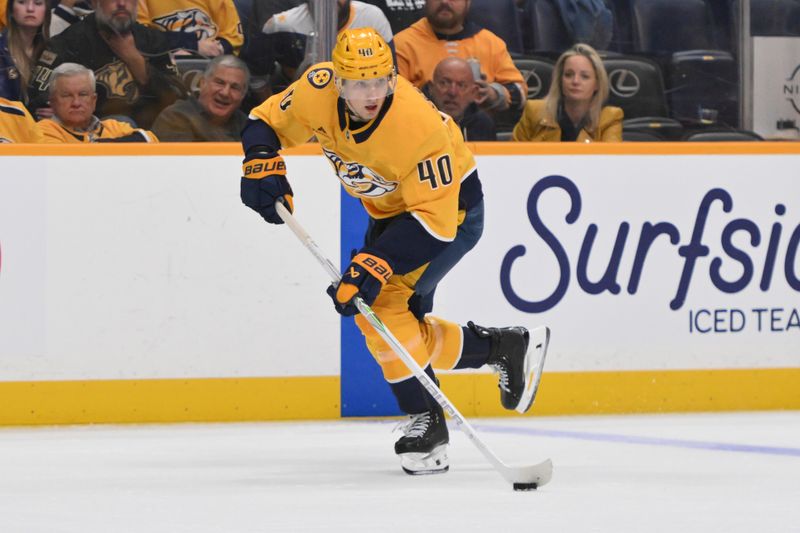 Oct 21, 2025; Nashville, Tennessee, USA;  Nashville Predators center Fedor Svechkiv (40) skates with the puck against the Anaheim Ducks during the third period at Bridgestone Arena. Mandatory Credit: Steve Roberts-Imagn Images