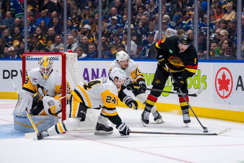 Oct 26, 2024; Vancouver, British Columbia, CAN; Pittsburgh Penguins goalie Alex Nedeljkovic (39) watches as defenseman Matt Grzelcyk (24) and forward Anthony Beauvillier (72) battle with Vancouver Canucks forward J.T. Miller (9) during the third period at Rogers Arena. Mandatory Credit: Bob Frid-Imagn Images