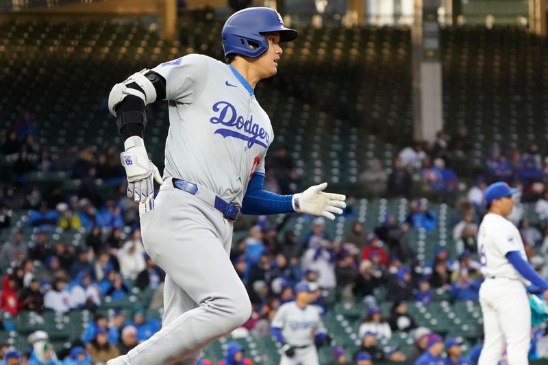 Apr 7, 2024; Chicago, Illinois, USA; Los Angeles Dodgers designated hitter Shohei Ohtani (17) hits a one run double against the Chicago Cubs during the eighth inning at Wrigley Field. Mandatory Credit: David Banks-USA TODAY Sports