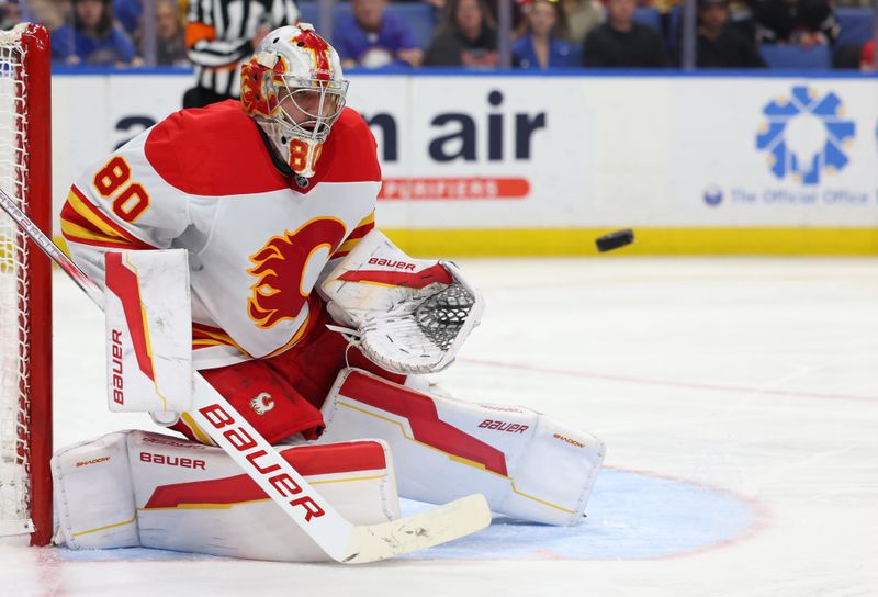 Nov 9, 2024; Buffalo, New York, USA;  Calgary Flames goaltender Dan Vladar (80) looks to make a save during the second period against the Buffalo Sabres at KeyBank Center. Mandatory Credit: Timothy T. Ludwig-Imagn Images