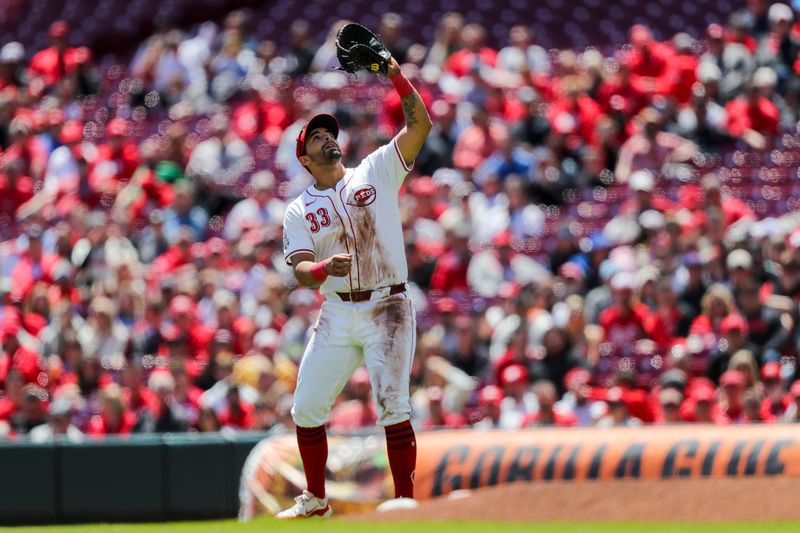 Apr 25, 2024; Cincinnati, Ohio, USA; Cincinnati Reds first baseman Christian Encarnacion-Strand (33) catches a pop up hit by Philadelphia Phillies outfielder Johan Rojas (not pictured) in the third inning at Great American Ball Park. Mandatory Credit: Katie Stratman-USA TODAY Sports