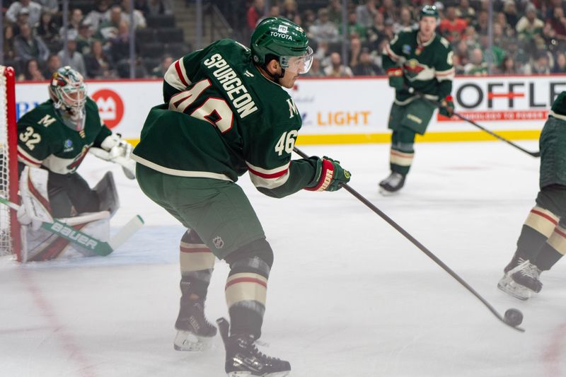 Nov 14, 2024; Saint Paul, Minnesota, USA; Minnesota Wild defenseman Jake Middleton (5) clears the puck against the Montreal Canadiens in the first period at Xcel Energy Center. Mandatory Credit: Matt Blewett-Imagn Images