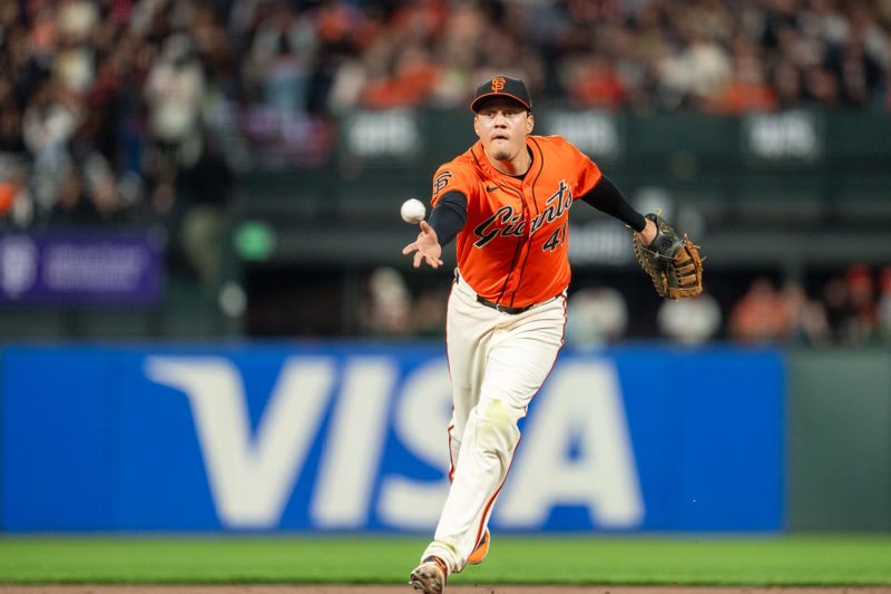 May 10, 2024; San Francisco, California, USA; San Francisco Giants first baseman Wilmer Flores (41) forces out Cincinnati Reds third baseman Jeimer Candelario (not pictured) during the sixth inning at Oracle Park. Mandatory Credit: Neville E. Guard-USA TODAY Sports