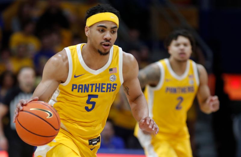 Feb 15, 2025; Pittsburgh, Pennsylvania, USA; Pittsburgh Panthers guard Ishmael Leggett (5) brings the ball up court on a fast-break against the Miami (Fl) Hurricanes during the first half at the Petersen Events Center. Mandatory Credit: Charles LeClaire-Imagn Images