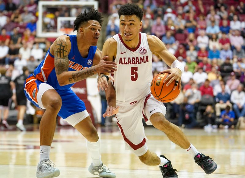 Feb 8, 2023; Tuscaloosa, Alabama, USA; Alabama Crimson Tide guard Jahvon Quinerly (5) drives to the basket against Florida Gators guard Will Richard (5) during the second half at Coleman Coliseum. Mandatory Credit: Marvin Gentry-USA TODAY Sports