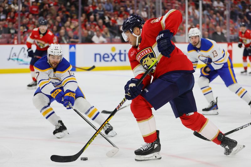 Apr 13, 2024; Sunrise, Florida, USA; Florida Panthers right wing Kyle Okposo (8) moves the puck against the Buffalo Sabres during the second period at Amerant Bank Arena. Mandatory Credit: Sam Navarro-USA TODAY Sports
