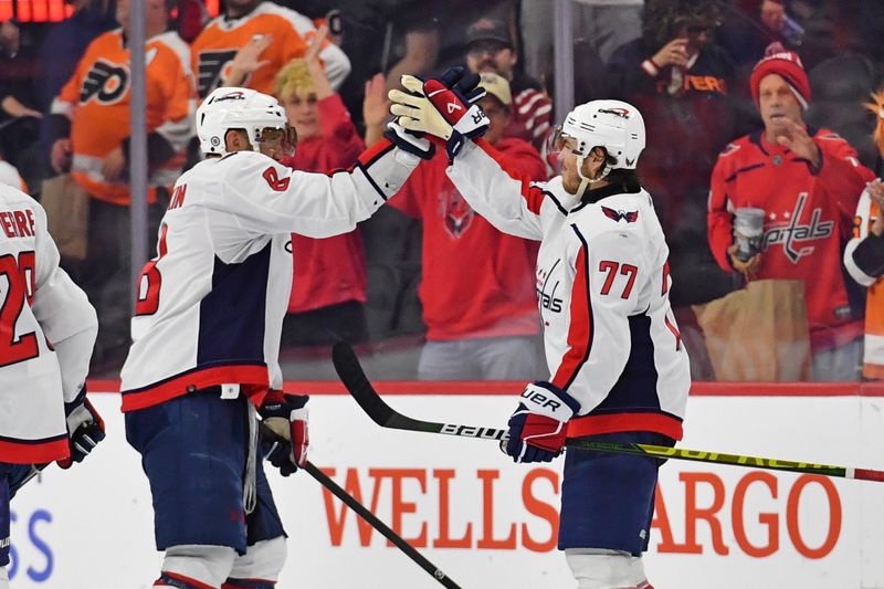 Apr 16, 2024; Philadelphia, Pennsylvania, USA; Washington Capitals left wing Alex Ovechkin (8) and right wing T.J. Oshie (77) celebrate win against the Philadelphia Flyers at Wells Fargo Center. Mandatory Credit: Eric Hartline-USA TODAY Sports