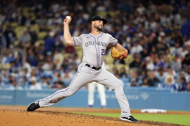 Jun 1, 2024; Los Angeles, California, USA;  Colorado Rockies relief pitcher Matt Carasiti (29) pitches during the eighth inning against the Los Angeles Dodgers at Dodger Stadium. Mandatory Credit: Kiyoshi Mio-USA TODAY Sports