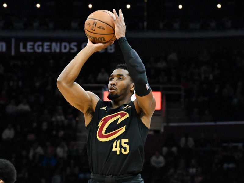 CLEVELAND, OHIO - APRIL 10: Donovan Mitchell #45 of the Cleveland Cavaliers shoots a three-point basket during the first half against the Memphis Grizzlies at Rocket Mortgage Fieldhouse on April 10, 2024 in Cleveland, Ohio. NOTE TO USER: User expressly acknowledges and agrees that, by downloading and or using this photograph, User is consenting to the terms and conditions of the Getty Images License Agreement. (Photo by Nick Cammett/Getty Images)