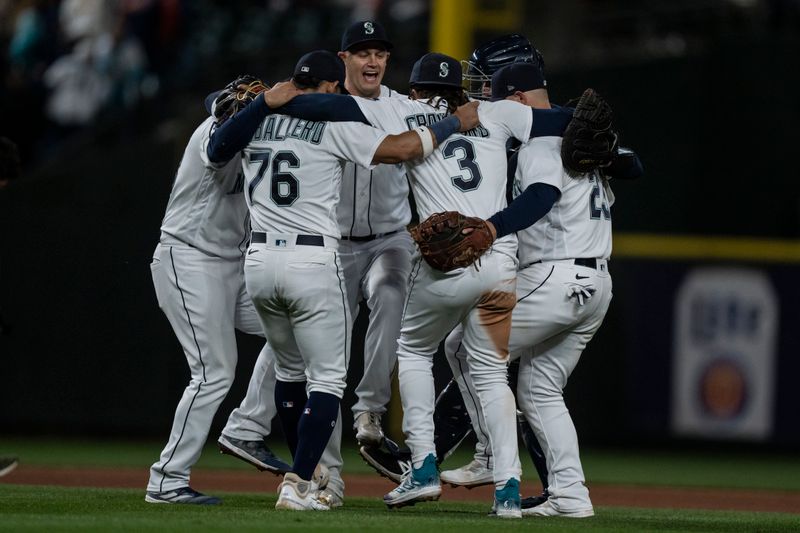 Apr 21, 2023; Seattle, Washington, USA; Seattle Mariners players including relief pitcher Paul Sewald (37), second baseman Jose Caballero (76), shortstop J.P. Crawford (3) and first baseman Ty France (23) celebrate after the game against the St. Louis Cardinals at T-Mobile Park. Mandatory Credit: Stephen Brashear-USA TODAY Sports