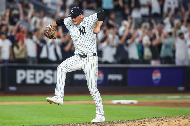 Jun 19, 2024; Bronx, New York, USA;  New York Yankees pitcher Anthony Misiewicz (58) reacts after the third out in the ninth inning against the Baltimore Orioles at Yankee Stadium. Mandatory Credit: Wendell Cruz-USA TODAY Sports