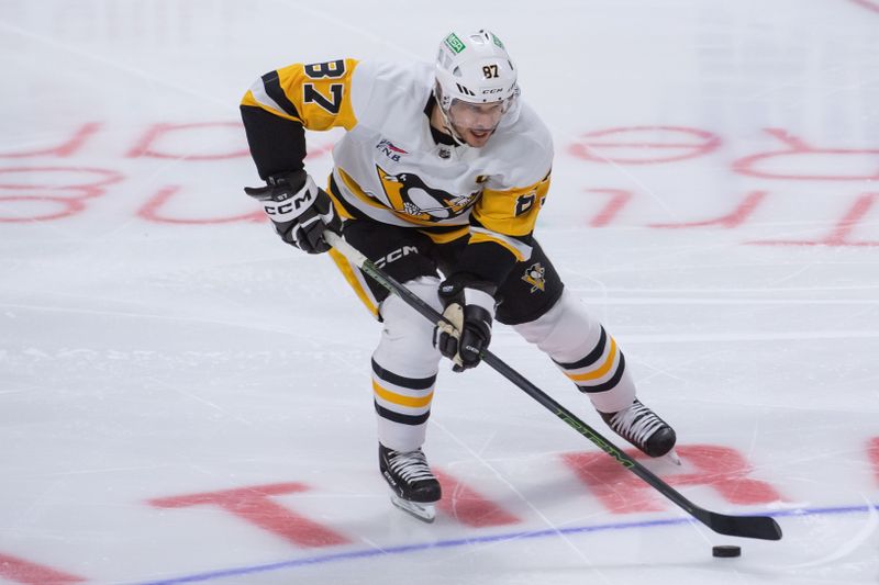 Dec 23, 2023; Ottawa, Ontario, CAN; Pittsburgh Penguins center Sidney Crosby (87) skates with the puck in the third period against the Ottawa Senators at the Canadian Tire Centre. Mandatory Credit: Marc DesRosiers-USA TODAY Sports